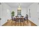 Bright dining room with hardwood floors, chandelier and wainscoting at 1000 Rivershore Rd, Charleston, SC 29492