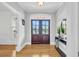 Elegant entryway with hardwood floors and double French doors at 1000 Rivershore Rd, Charleston, SC 29492