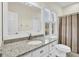 Bathroom with granite countertop, white cabinets, and a shower/tub combo at 1000 Rivershore Rd, Charleston, SC 29492