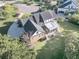 Bird's-eye view of a house showcasing its backyard and neighborhood setting at 1000 Rivershore Rd, Charleston, SC 29492