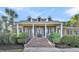 Two story house with columns and landscaping at 1000 Rivershore Rd, Charleston, SC 29492