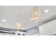 Elegant crystal pendant lights above kitchen island at 1000 Rivershore Rd, Charleston, SC 29492