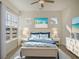 Bright bedroom with a queen-size bed and beach-themed decor at 307 Trailmore Ln, Summerville, SC 29486