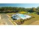 Aerial view of resort-style pool with cabana and surrounding landscape at 170 Yarrow Way, Moncks Corner, SC 29461