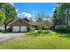 Brick house with a two-car garage and well-manicured lawn at 1610 Dennis Blvd, Moncks Corner, SC 29461