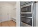 Bright laundry room with built-in shelves and modern microwave at 2802 Lacy St, North Charleston, SC 29406