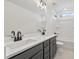 Modern bathroom with double vanity, gray cabinets, and a shower/tub combo at 2802 Lacy St, North Charleston, SC 29406