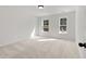 Well-lit bedroom with neutral carpeting and large windows at 2802 Lacy St, North Charleston, SC 29406