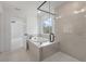 Bathroom with garden tub, walk-in shower, and window at 2802 Lacy St, North Charleston, SC 29406