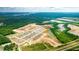 Aerial view of a new home community with houses, ponds, and landscaping at 121 Yarrow Way, Moncks Corner, SC 29461