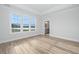 Bright bedroom with large windows, hardwood floors and an ensuite bathroom at 126 Grange Cir, Summerville, SC 29486