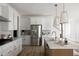 Modern kitchen with stainless steel appliances and white cabinets at 424 Grove End Rd, Moncks Corner, SC 29461