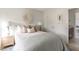 Tranquil bedroom with a neutral palette, soft bedding, and access to a bathroom at 424 Grove End Rd, Moncks Corner, SC 29461