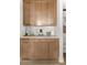 Butlers pantry with light wood cabinets and quartz countertops at 424 Grove End Rd, Moncks Corner, SC 29461