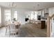 Open concept dining room with kitchen and living room views at 424 Grove End Rd, Moncks Corner, SC 29461