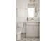Clean bathroom with gray vanity, modern fixtures, and geometric floor tiles at 424 Grove End Rd, Moncks Corner, SC 29461