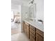 Double vanity bathroom with modern fixtures and a view into the bedroom at 424 Grove End Rd, Moncks Corner, SC 29461