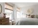 Charming bedroom with light walls, window blinds, and a boho-chic wall hanging at 424 Grove End Rd, Moncks Corner, SC 29461