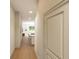 Bright hallway with wood floors leading to living areas at 7426 Indigo Palms Way, Johns Island, SC 29455