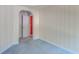 Empty bedroom with blue carpet and an arched doorway at 1431 Belcourt Ln, Mount Pleasant, SC 29466