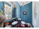 Powder room with dark vanity and blue walls at 1531 Murphys Island Ct, Awendaw, SC 29429