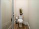 Small half bathroom with toilet and pedestal sink at 1531 Murphys Island Ct, Awendaw, SC 29429