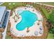 Resort-style pool with plenty of lounge chairs and umbrellas at 1679 Siloh Dr # 494, Mount Pleasant, SC 29466