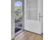 Open white front door with glass panes; leads to the interior at 1811 Walsingham Way, Charleston, SC 29412