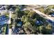 Aerial view of a property near a road with surrounding trees and buildings at 3538 S Live Oak Dr, Moncks Corner, SC 29461