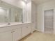 Double vanity bathroom with a large mirror and walk-in closet at 219 Dean Hall Ave, Moncks Corner, SC 29461