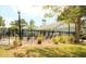 Community pool and clubhouse with surrounding landscaping at 1481 Center Extension St # 208, Mount Pleasant, SC 29464