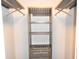 Well-organized closet with custom shelving and hanging rods at 1481 Center Extension St # 208, Mount Pleasant, SC 29464