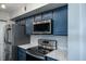 Modern kitchen with stainless steel appliances and white quartz countertops at 1481 Center Extension St # 208, Mount Pleasant, SC 29464