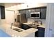 Modern kitchen with stainless steel appliances and white quartz countertops at 1481 Center Extension St # 208, Mount Pleasant, SC 29464