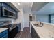 Modern kitchen with stainless steel appliances and blue cabinets at 1481 Center Extension St # 208, Mount Pleasant, SC 29464