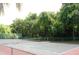 Well-maintained tennis court surrounded by trees at 1481 Center Extension St # 208, Mount Pleasant, SC 29464