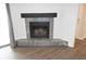 Cozy fireplace with a rustic wood mantel and blue tile surround at 1481 Center Extension St # 208, Mount Pleasant, SC 29464