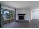 Living room with fireplace, water view, and sliding glass doors to balcony at 1481 Center Extension St # 208, Mount Pleasant, SC 29464