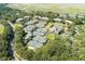Aerial view of condo building 1640 near tennis courts and water at 1640 Live Oak Park, Seabrook Island, SC 29455