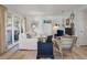 Cozy living room with white sofa, blue accents, and a view to balcony at 1640 Live Oak Park, Seabrook Island, SC 29455
