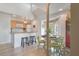 Charming kitchen with white cabinets, a breakfast bar, and light wood floors at 1640 Live Oak Park, Seabrook Island, SC 29455