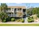 Front view of condo with landscaped grounds at 1640 Live Oak Park, Seabrook Island, SC 29455