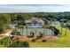 Aerial view of tennis courts and clubhouse with palm trees at 1640 Live Oak Park, Seabrook Island, SC 29455