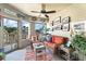 Sunroom with wicker furniture, colorful rug, and scenic views at 1640 Live Oak Park, Seabrook Island, SC 29455