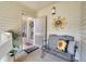 Inviting entryway with a bench, sunflower pillow, and sunburst wall art at 1640 Live Oak Park, Seabrook Island, SC 29455