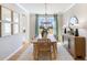 Bright dining room features a wood table, chairs, and stylish light fixture at 164 Middleton Dr, Goose Creek, SC 29445