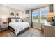 Cozy bedroom with a comfortable bed and large windows at 164 Middleton Dr, Goose Creek, SC 29445
