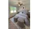 Large main bedroom with tufted headboard and ottoman at 3956 Treebranch Circle, Mount Pleasant, SC 29429