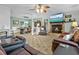 Spacious living room with a stone fireplace and large TV at 1351 Winifred St, Mount Pleasant, SC 29464