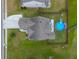 Top-down view of a house with a gray roof, and a fenced backyard with a blue above-ground pool at 575 Rosings Dr, Summerville, SC 29486